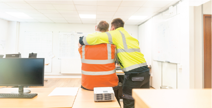 Isoclad colleagues working together in the office.