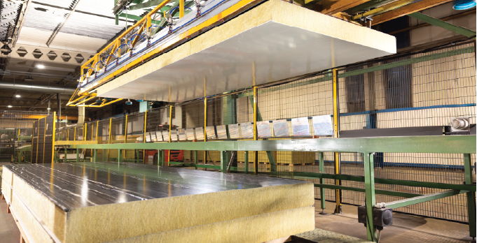 Mineral wool panel core moving through the Isoclad manufacturing line.