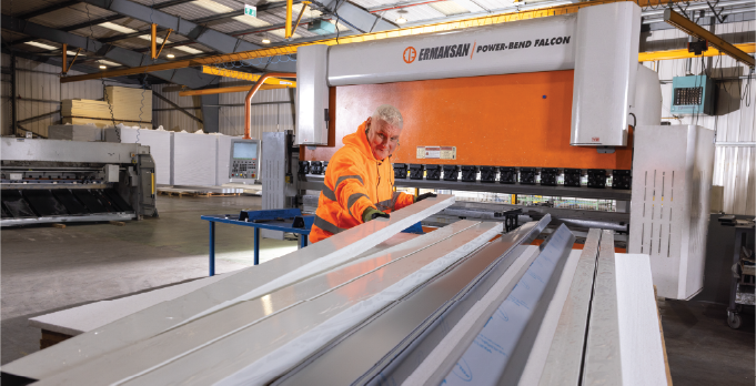 Isoclad production operative organising metal flashings.