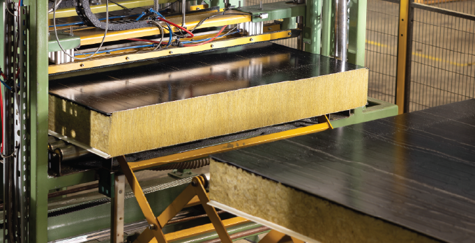 Mineral wool insulated panels moving through the Isoclad manufacturing line.